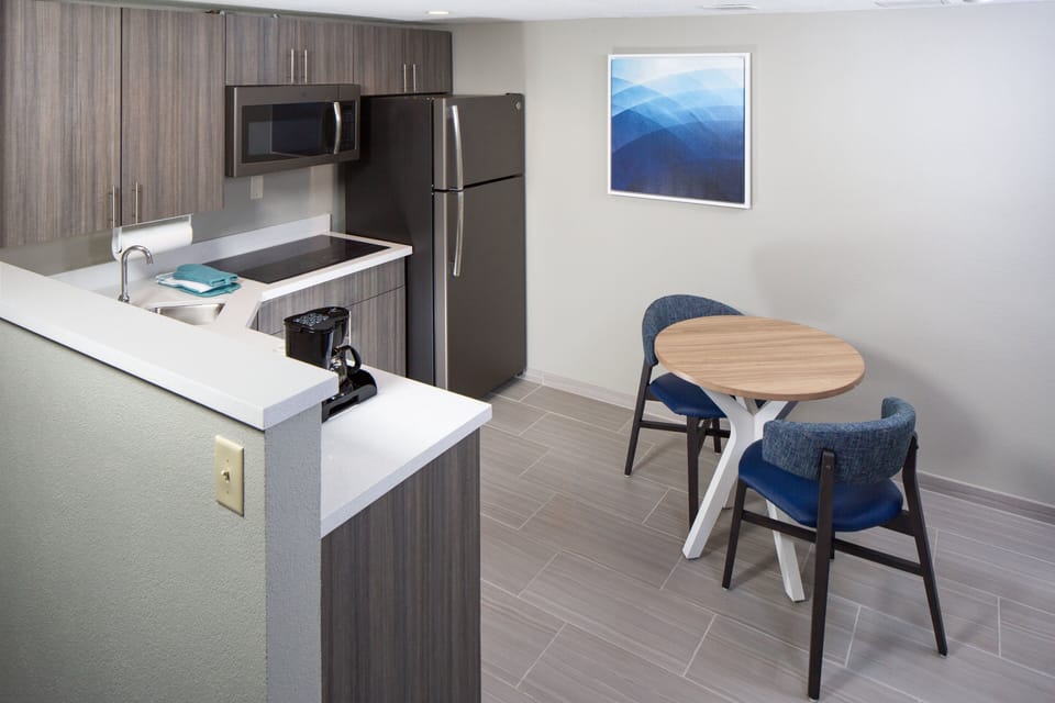 Suite, 1 Bedroom | Hypo-allergenic bedding, desk, laptop workspace, iron/ironing board
