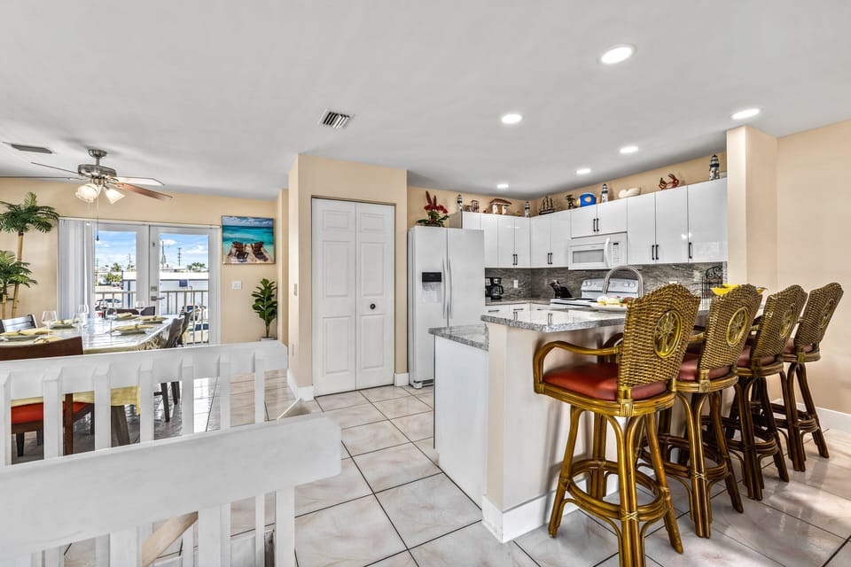 Casual meals, morning coffee, or evening snacks are easy at the spacious kitchen breakfast bar.