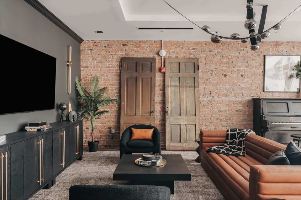 The living room offers stylish and comfortable seating for the whole group, perfect for relaxing or gathering together.