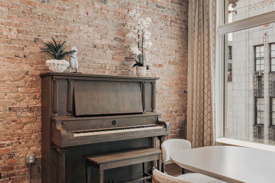 No stay in Nashville is complete without a piano—and this dining area delivers, with a beautiful instrument that adds a touch of local charm to the space.