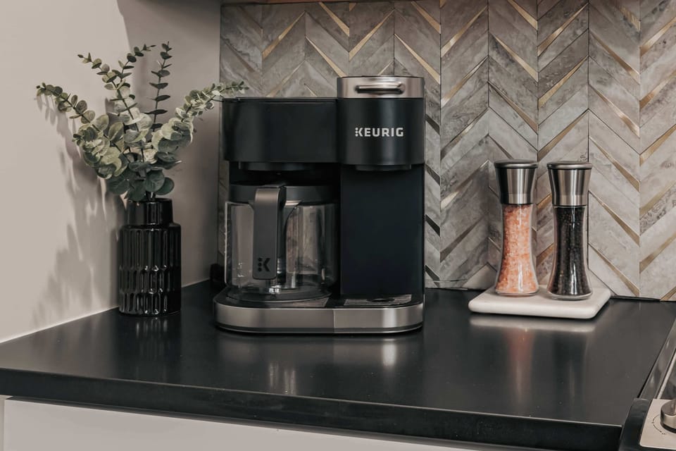 Coffee lovers will appreciate the Keurig Duo, offering the flexibility to brew both K-Cups and fresh local ground coffee—both of which are thoughtfully provided for your stay.