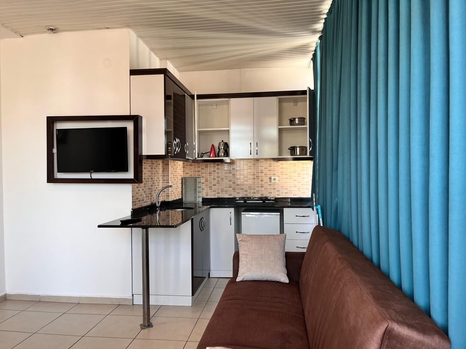 Family Room Loft (3 single beds or 1 double bed and 1 single bed) | Private kitchen | Mini-fridge