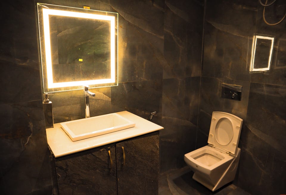 Shower, rainfall showerhead, eco-friendly toiletries, towels