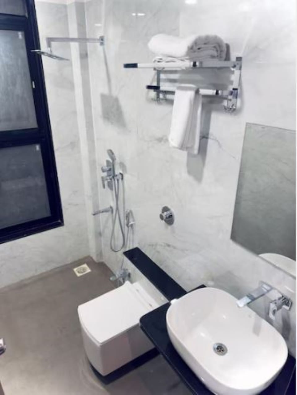 Deluxe Room AC | Bathroom | Shower, towels, soap, toilet paper