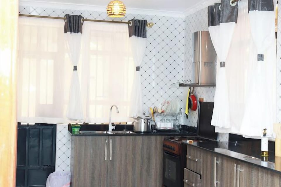 Family Apartment, City View | Private kitchen | Fridge, microwave, cookware/dishes/utensils
