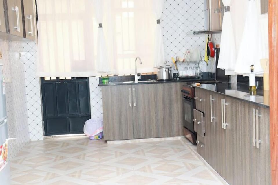 Family Apartment, City View | Private kitchen | Fridge, microwave, cookware/dishes/utensils
