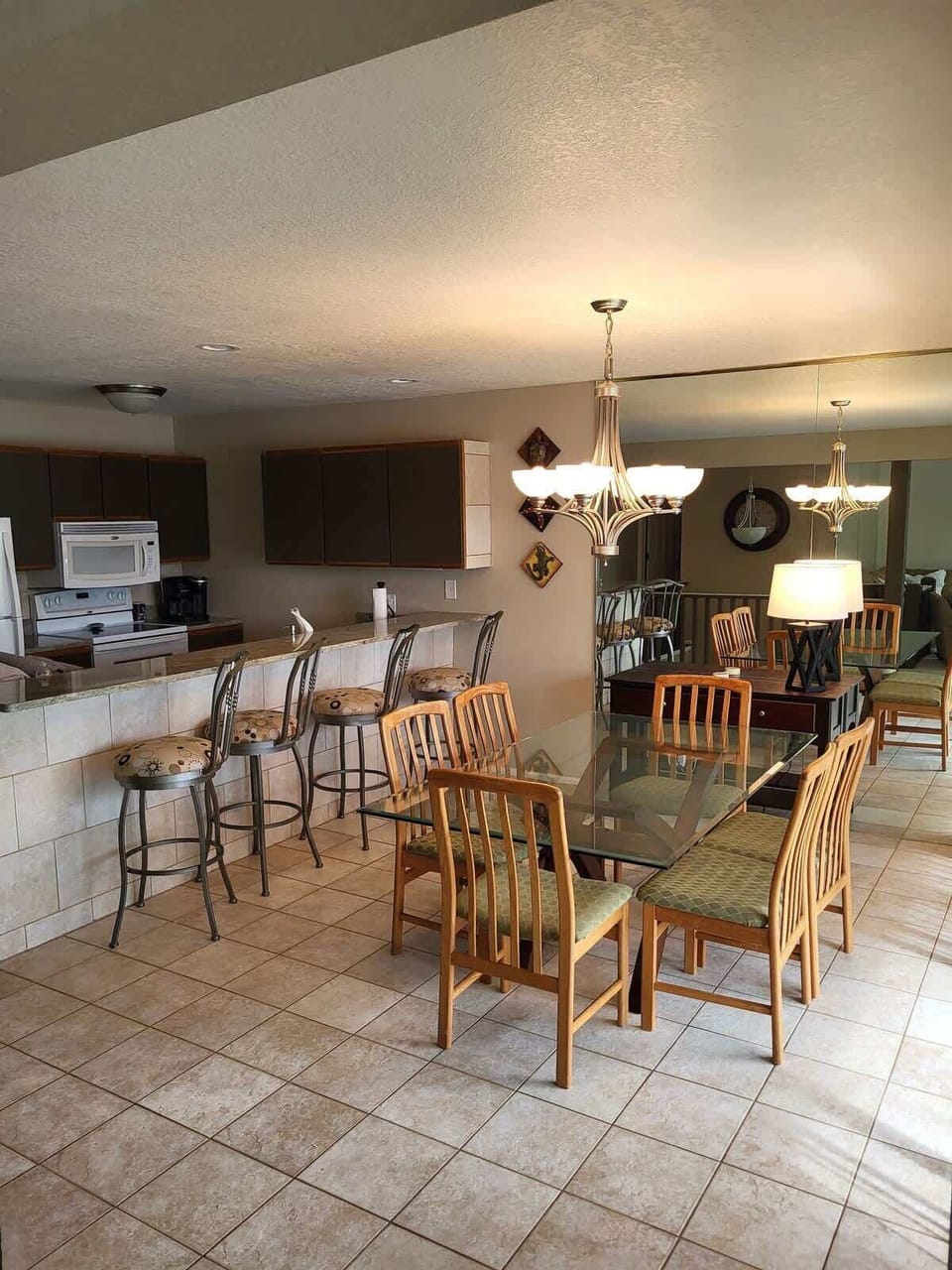 Dining room table with seating for 6. Breakfast bar with seating for 4 