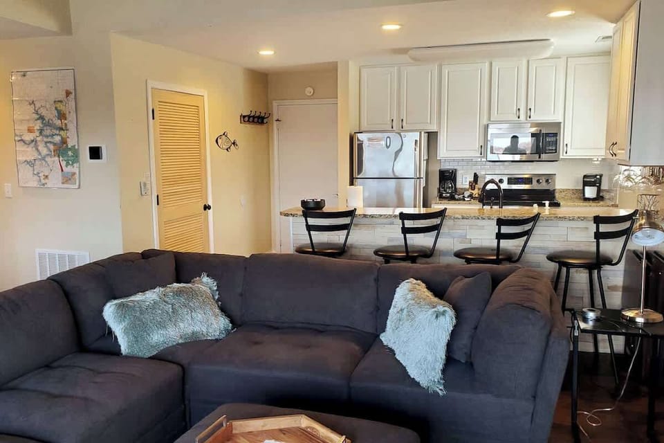 Fully stocked kitchen with kitchen counter bar top. 