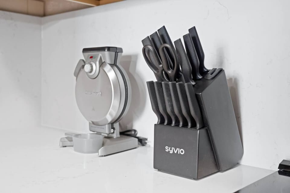 Our kitchen features a versatile waffle maker and a set of high-quality knives, our kitchen ensures you have the tools for both breakfast and gourmet meals. Enhance your cooking experience during your stay with us!