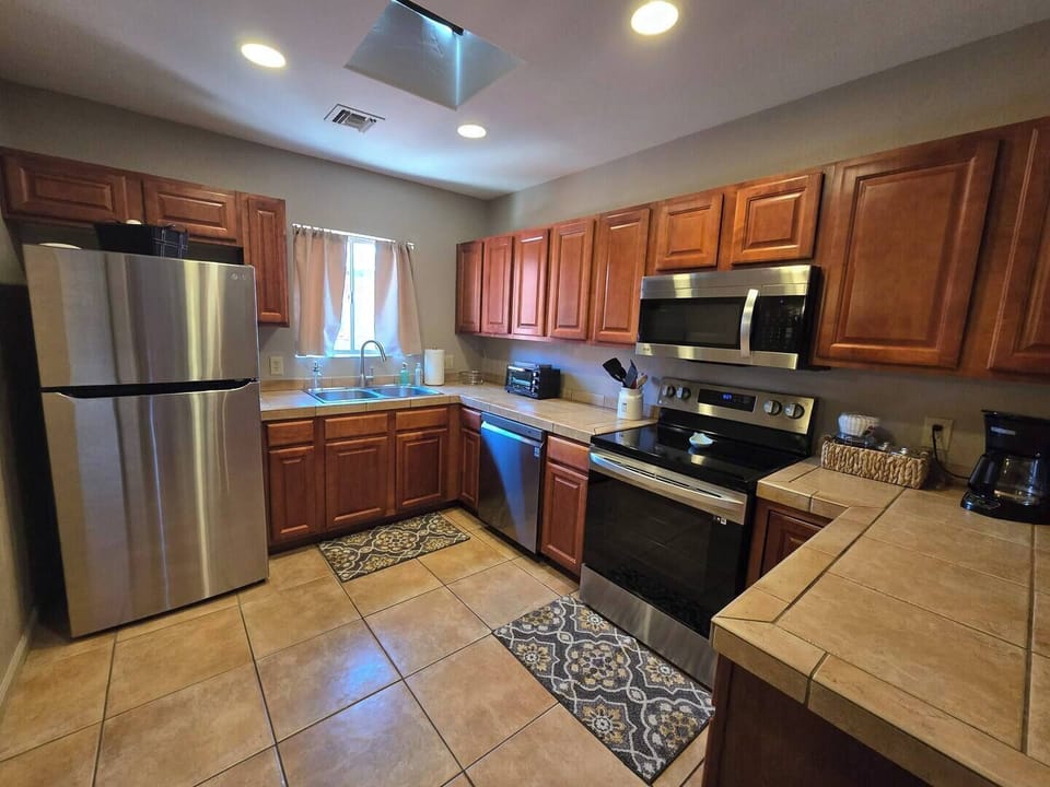 Our spacious and well-equipped kitchen provides plenty of counter space, making it easy to prepare meals, entertain, and enjoy cooking during your stay.