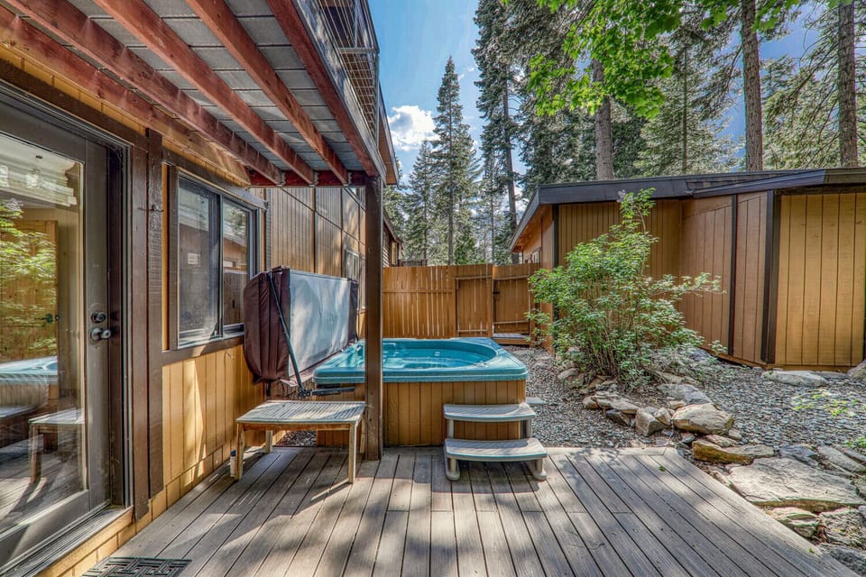 Unwind in your private hot tub surrounded by trees—perfect for stargazing or soothing soaks after a day of adventure.
