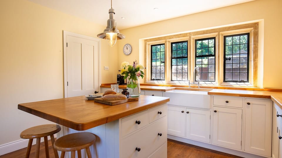 A beautiful country kitchen with traditional cottage windows