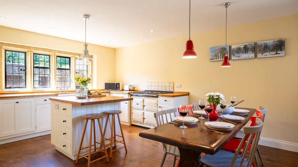 The central island has two stools to sit at and provides great extra surface space for prepping meals or serving nibbles.