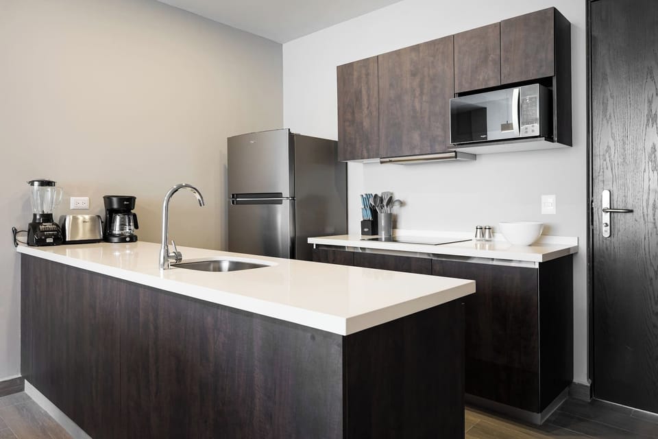 Modern kitchen with full-size appliances and essentials for preparing meals during your stay.