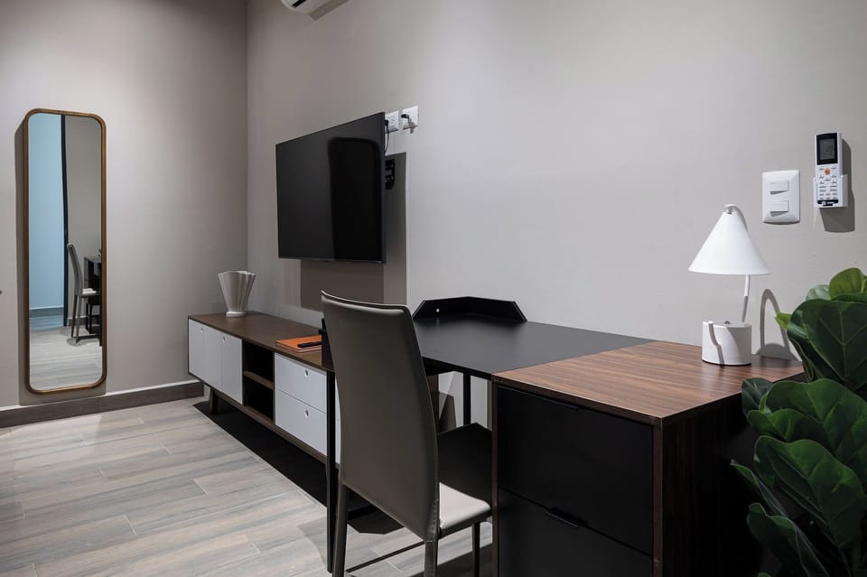 Stylish desk and full-length mirror available in bedroom 2.