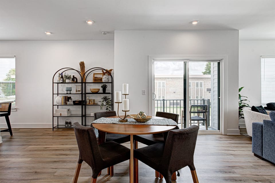 Enjoy a designed open-concept space with a modern kitchen equipped with quartz countertops, stainless steel appliances, and all essentials for home cooking. 