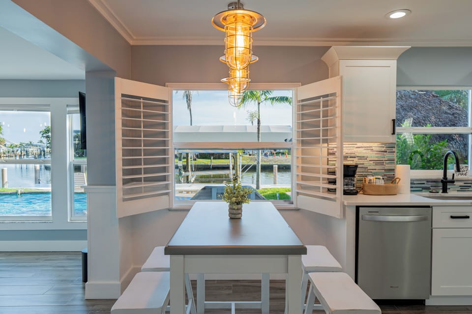 Enjoy sunlit meals at the kitchen table with stunning bay views.