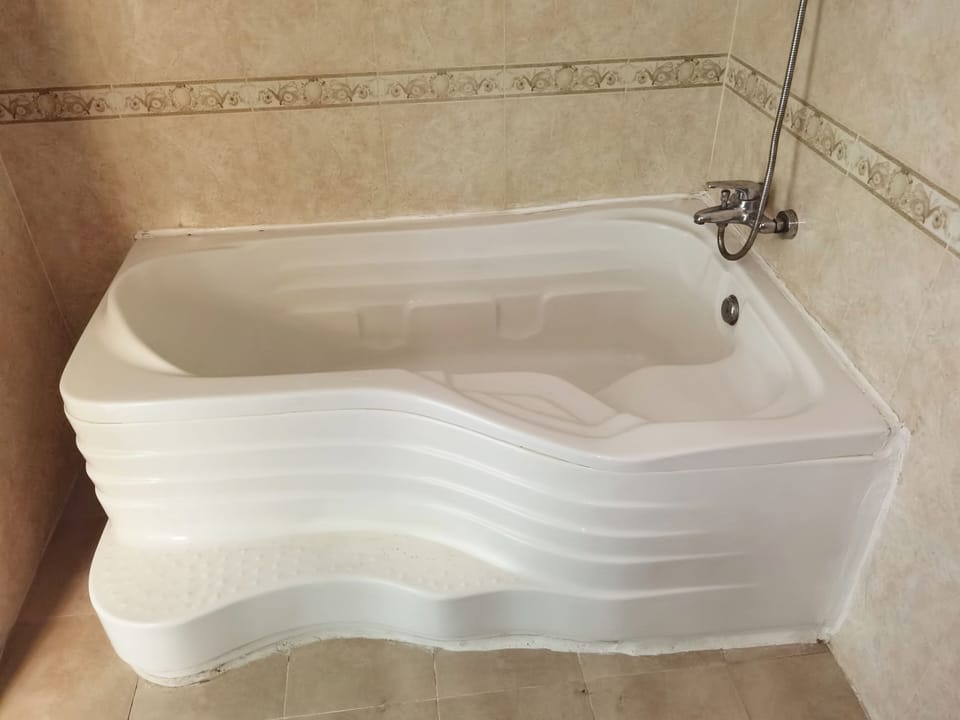 Deluxe Double Room, Balcony, City View | Bathroom | Shower, hair dryer, slippers, towels
