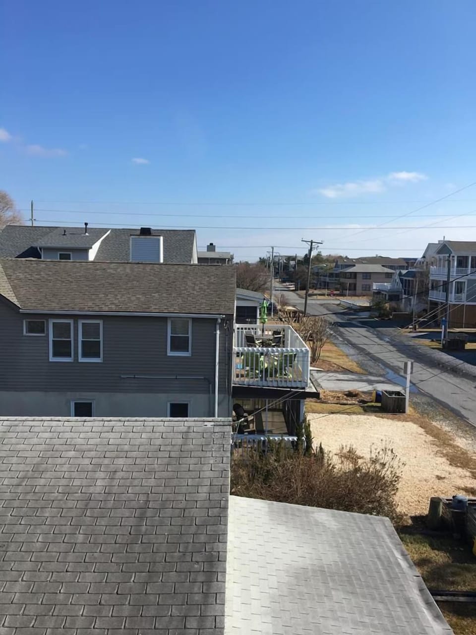 Enjoy the scenic beachside community view from this vacation rental, located just steps away from the sandy shore.