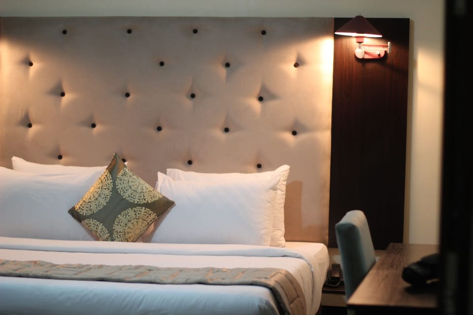 Premium bedding, desk, laptop workspace, free WiFi