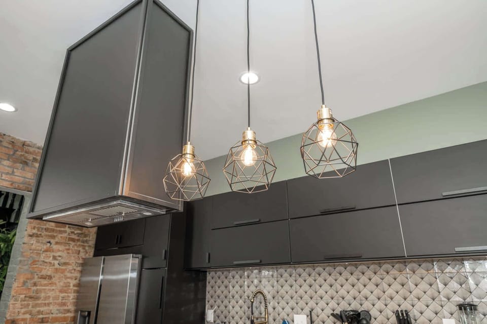 The sleek, modern kitchen offers ample space & every home comfort​