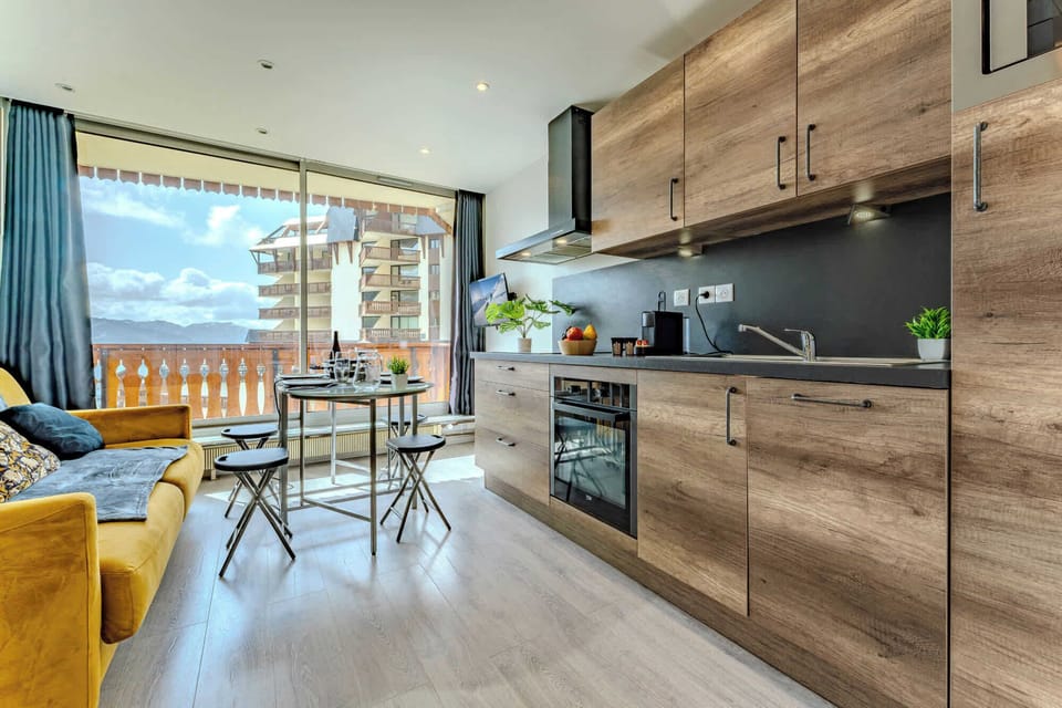 Fully Equipped Kitchen with Alpine Style Touches Cook your favorite meals in a stylish kitchen that blends rustic charm with modern functionality.