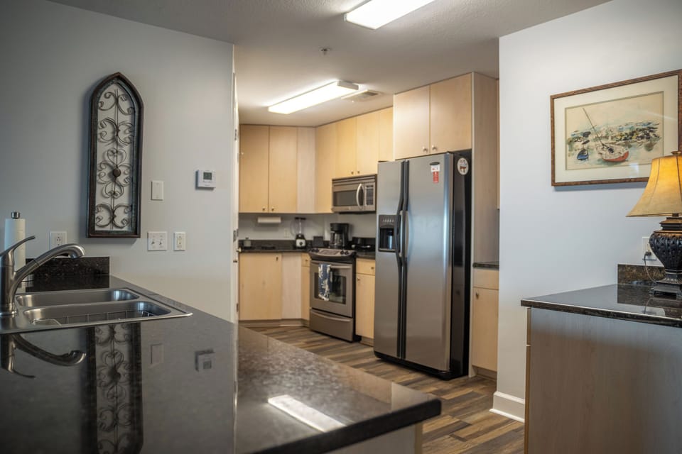 Full kitchen with stainless steel appliances 