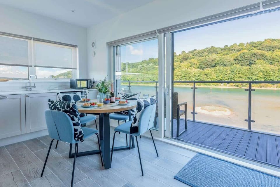This dining area is the perfect spot to watch paddleboarders glide by - whether you're soaking up the sun on a summer’s day or enjoying a cosy winter evening.