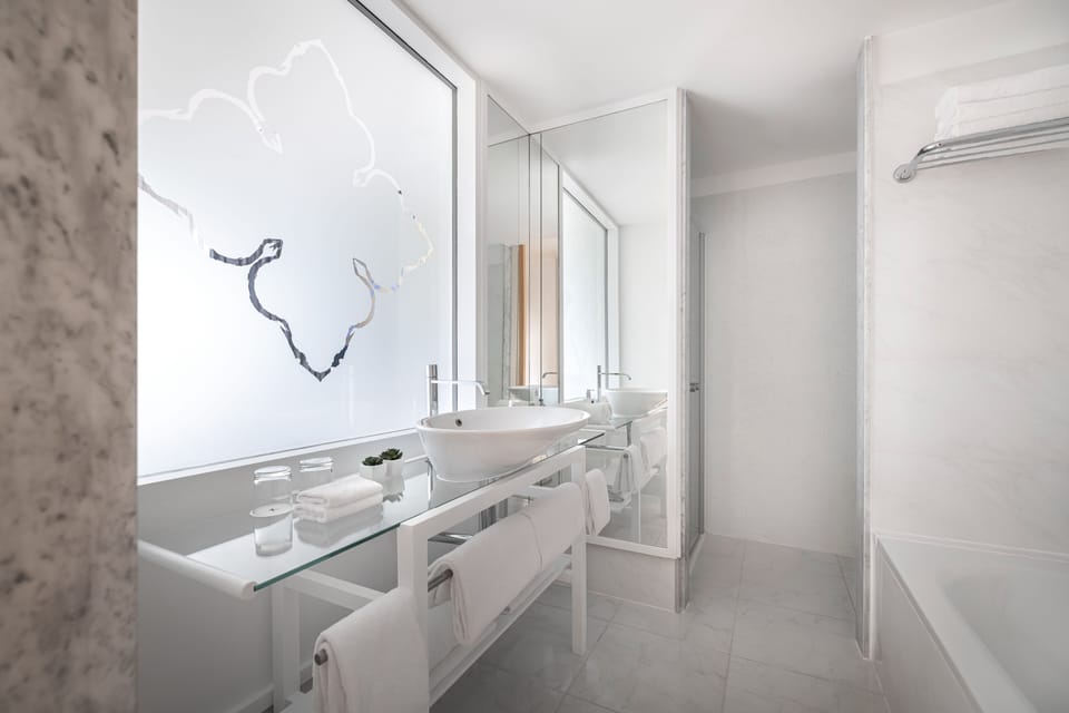 Separate tub and shower, free toiletries, hair dryer, bathrobes