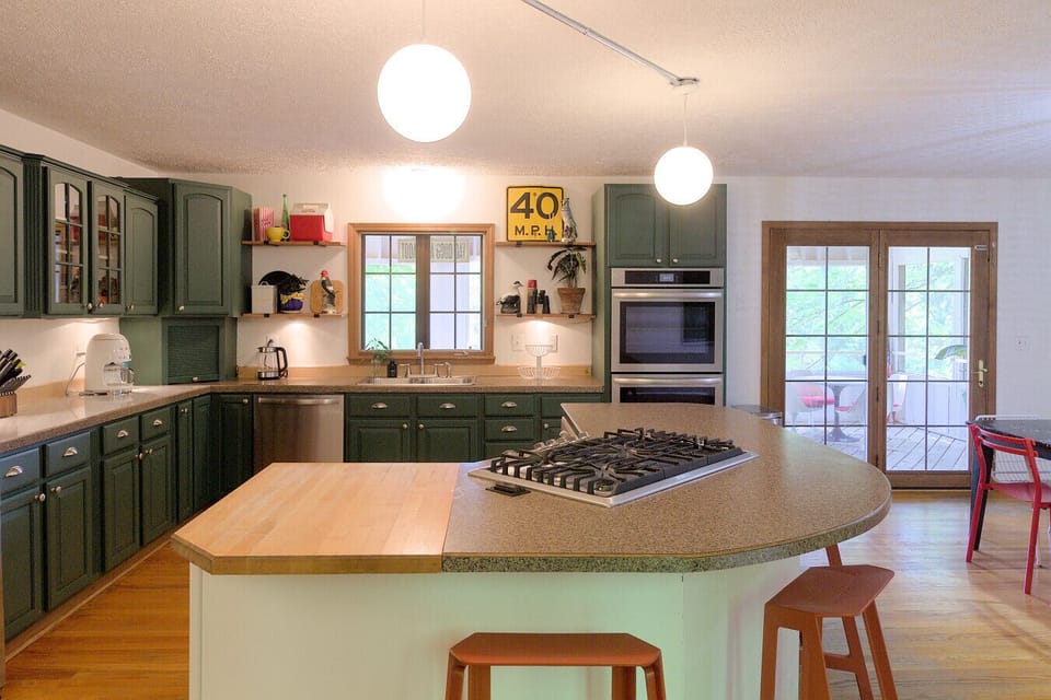 Bright kitchen with a spacious island offering extra seating, creating the perfect open and inviting space for gathering 🌿🍴