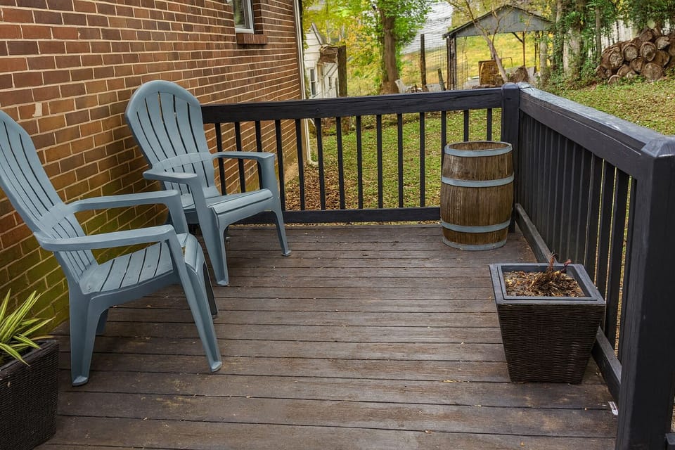 Private Large Backyard With A Deck And Surrounded By Mature Shade Trees.
