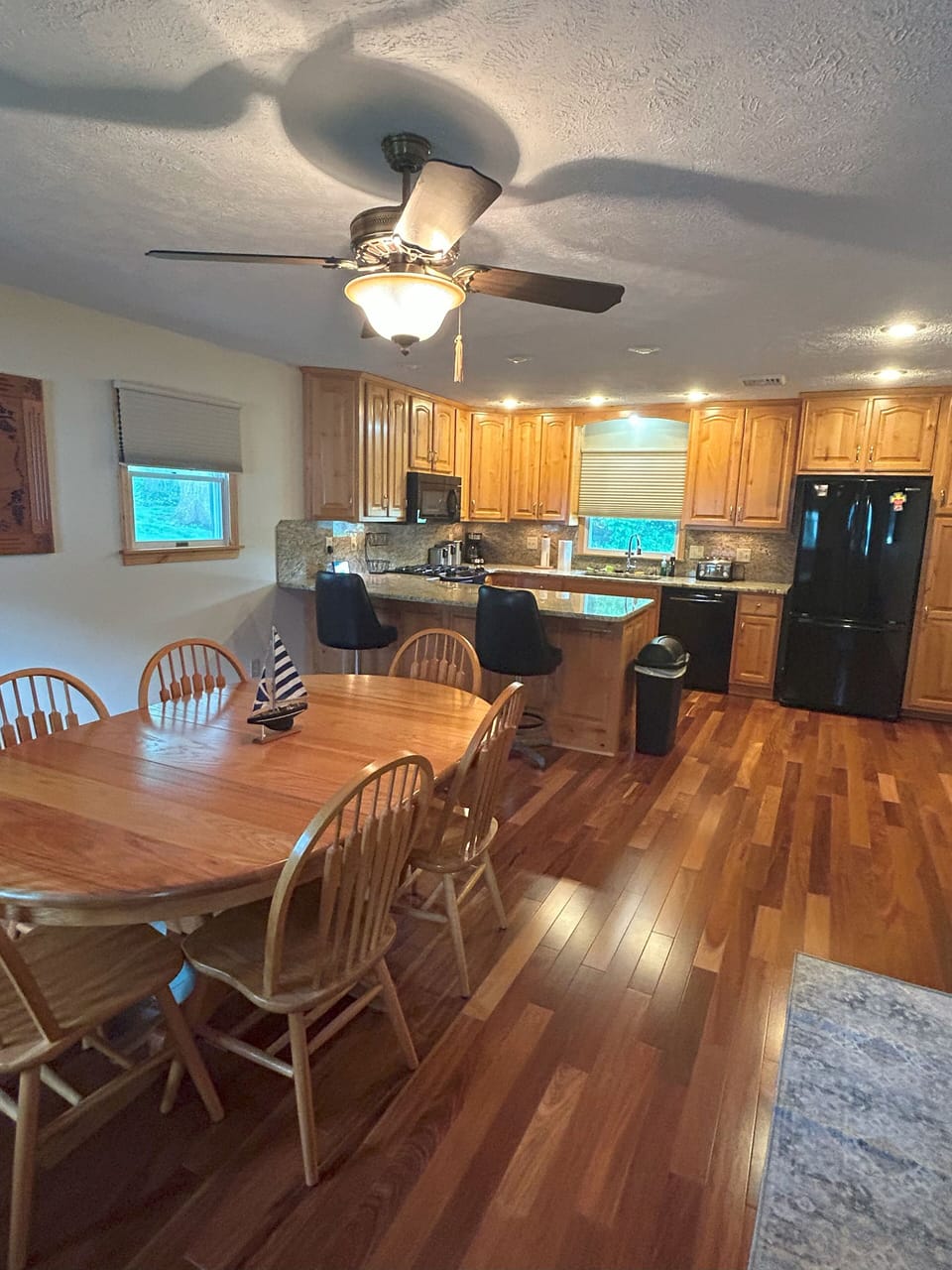 Large dining room adjourns large, fully stocked kitchen