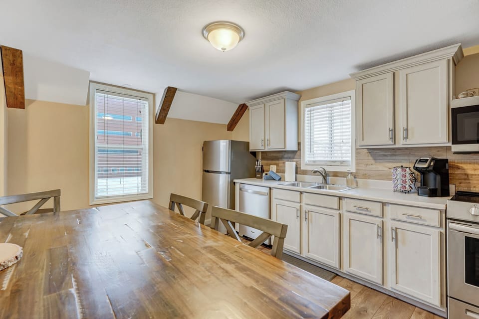 Kitchen and dining upstairs, the table seats 4
