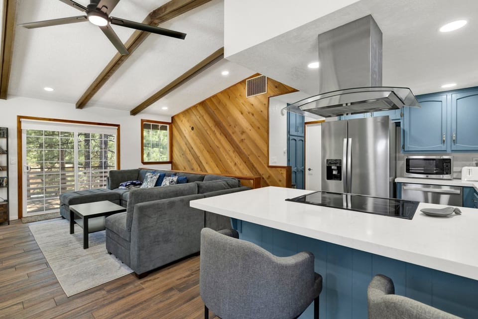 Fully equipped cabin kitchen with ample cabinetry, stove, fridge, microwave, and coffee maker—perfect for cooking meals, morning coffee, and feeling right at home on your stay.