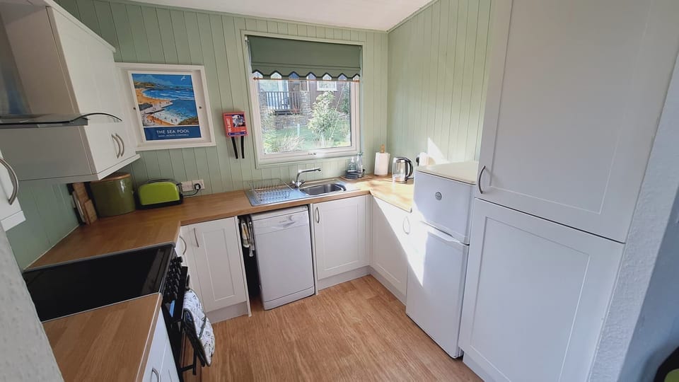 Small but well equipped kitchen with hob/oven, kettle, toaster fridge/freezer, microwave, dishwasher and all the necessary cookware, utensils etc you will need to enjoy home cooked family meals.