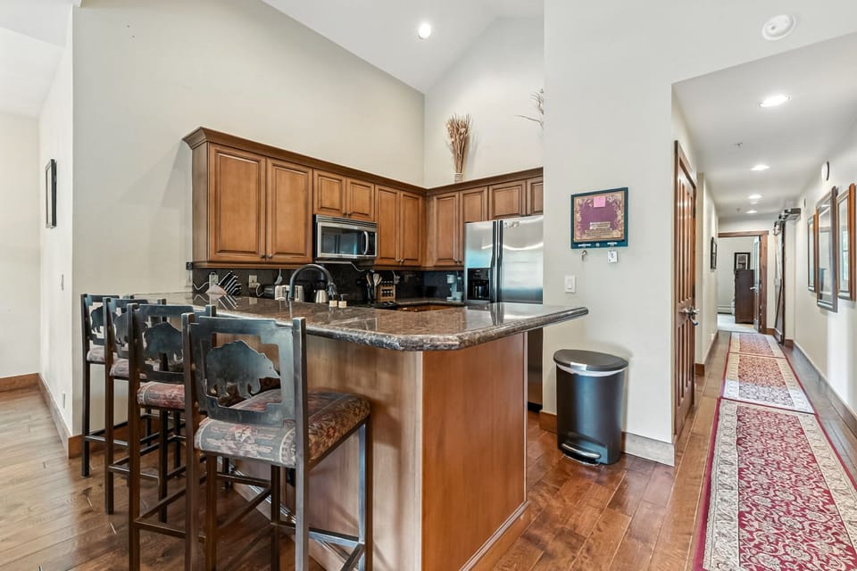 Kitchen: Main floor, drip coffee maker, Keurig, toaster, cooking utensils, tableware