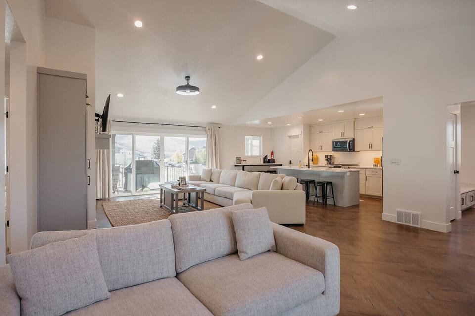 Living area featuring recessed lighting and high vaulted ceiling