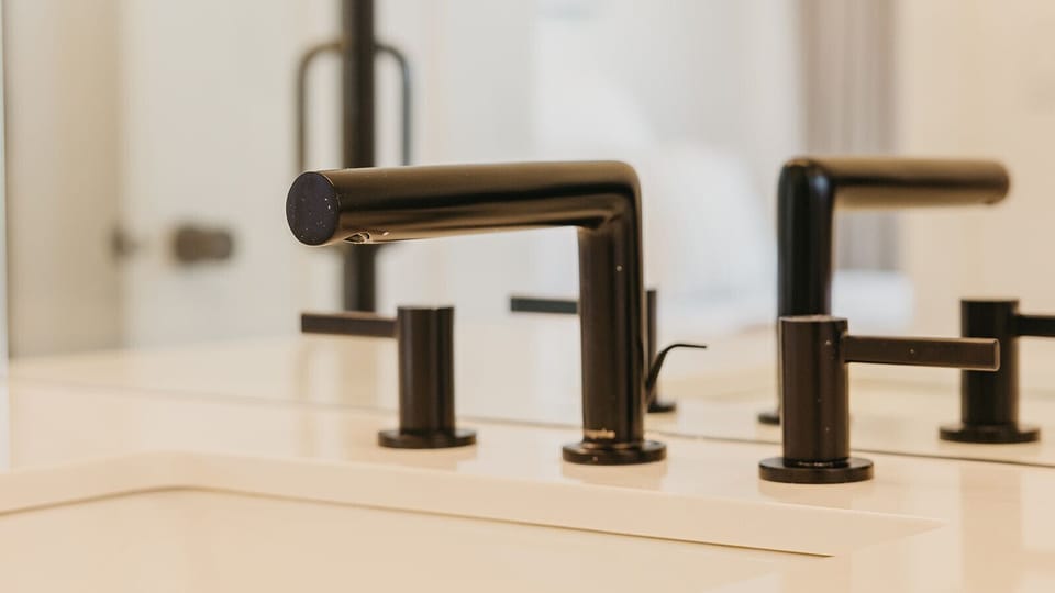 Modern fixtures meet rustic charm in this thoughtfully designed bathroom retreat