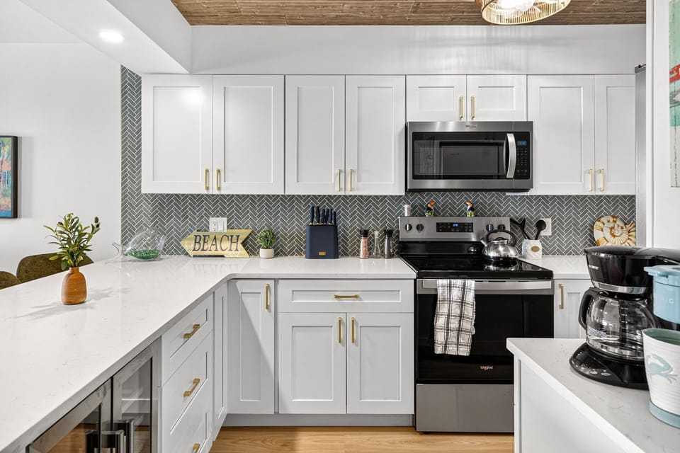 Beautifully updated kitchen at this Panama City Beach family vacation rental at Regency Towers. Enjoy modern finishes, coastal comfort, and easy access to your private Gulf-front balcony at one of the most beloved resorts in Panama City Beach.