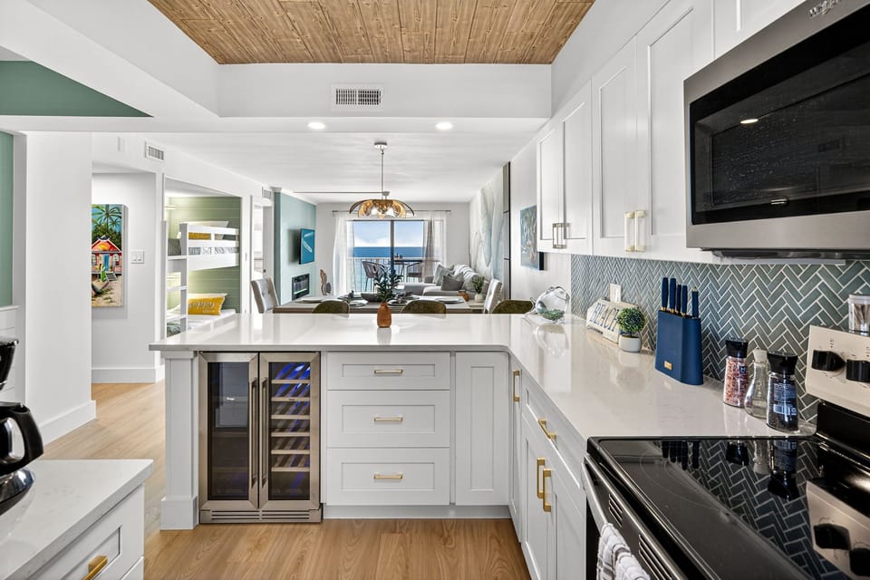 Fully equipped kitchen with appliances, cookware, and utensils at The Emerald Lookout by Relax and Renew Rentals. Enjoy an ocean view condo in Panama City Beach designed for family meals, beach vacations, and relaxing coastal stays near the Gulf.