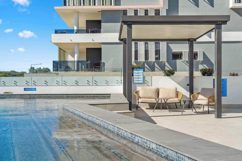 Enjoy laid-back poolside moments from the covered seating area, ideal for cooling off without leaving the water’s edge.