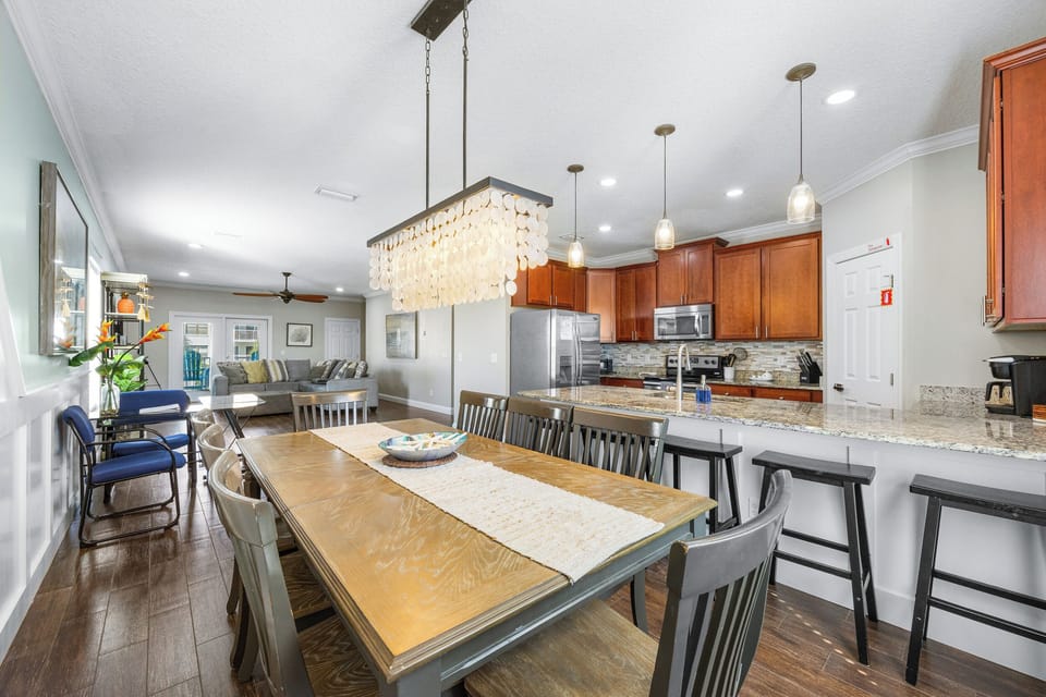Kitchen with pendant lighting and clean, modern design