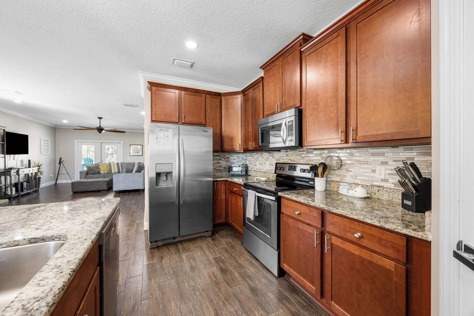 Fully equipped kitchen with stainless appliances and ample space