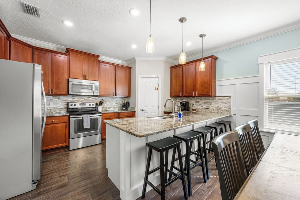 Kitchen with island seating and bright, open layout
