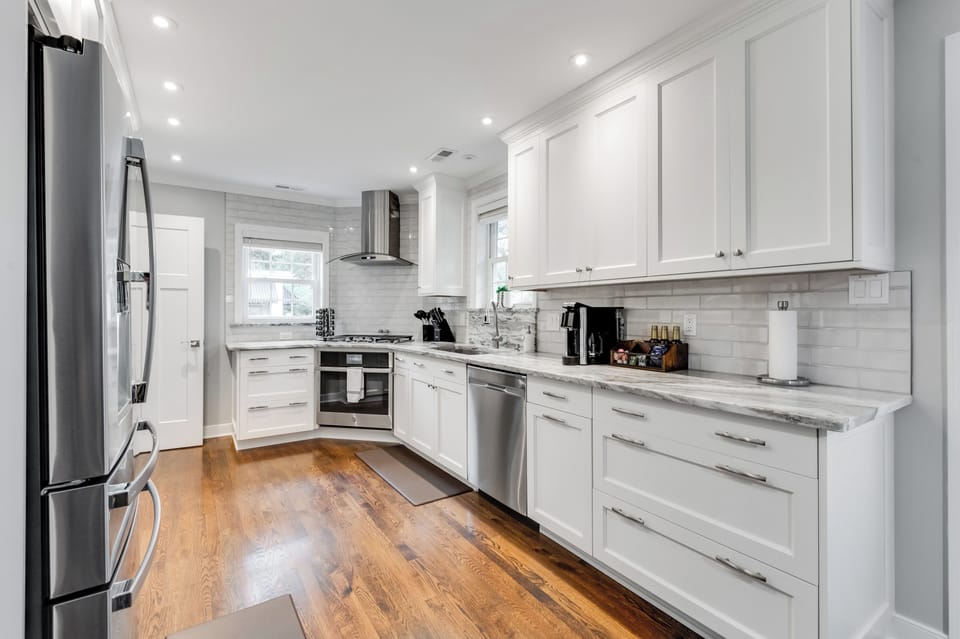Enjoy home-cooked meals in this clean and modern kitchen.