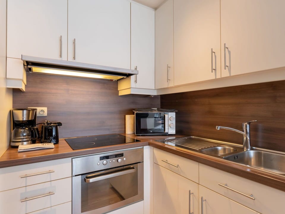 Countertop, Kitchen Appliance, Kitchen, Cabinetry, Flooring, Major Appliance, Interior Design, Wood, Furniture, Floor