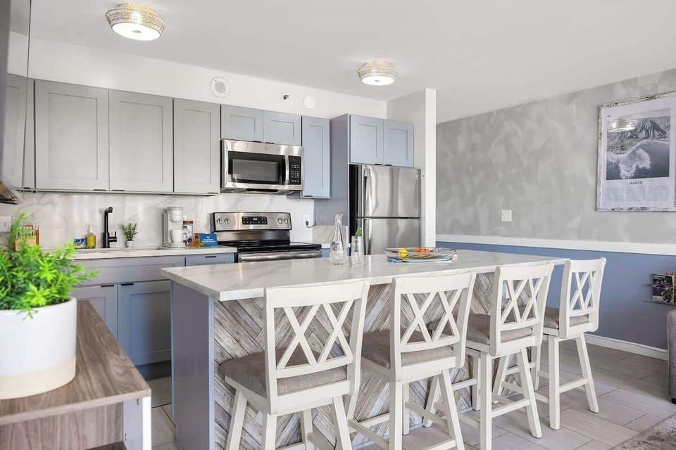 This fully equipped kitchen and dining area offer everything you need to whip up delicious meals and enjoy the comforts of home during your stay.