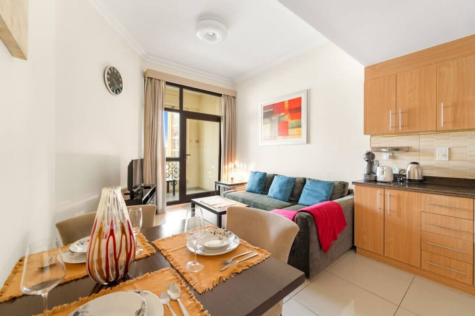 Living Room: Bright and inviting space with vibrant decor and stunning views to relax and unwind!