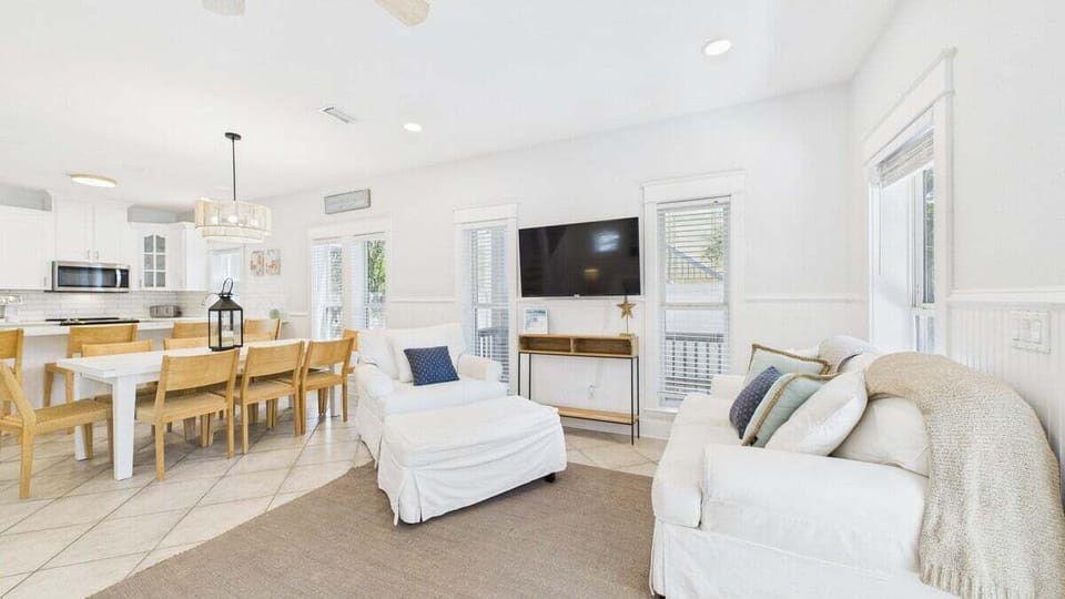 Open concept living area with stylish furnishings