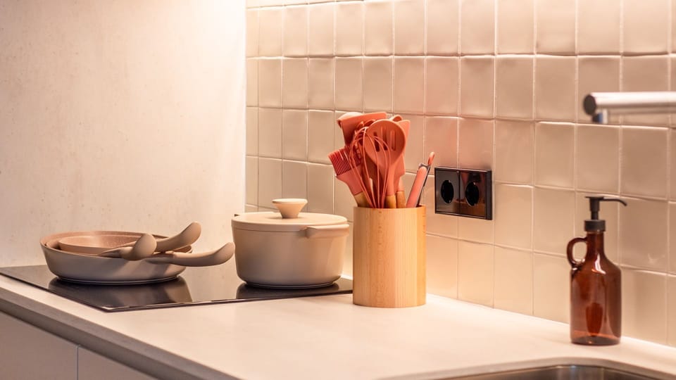 Thoughtful design meets function with beautiful ceramic cookware and sleek surfaces.
#KitchenInspo #ShortTermRental #DesignKitchen